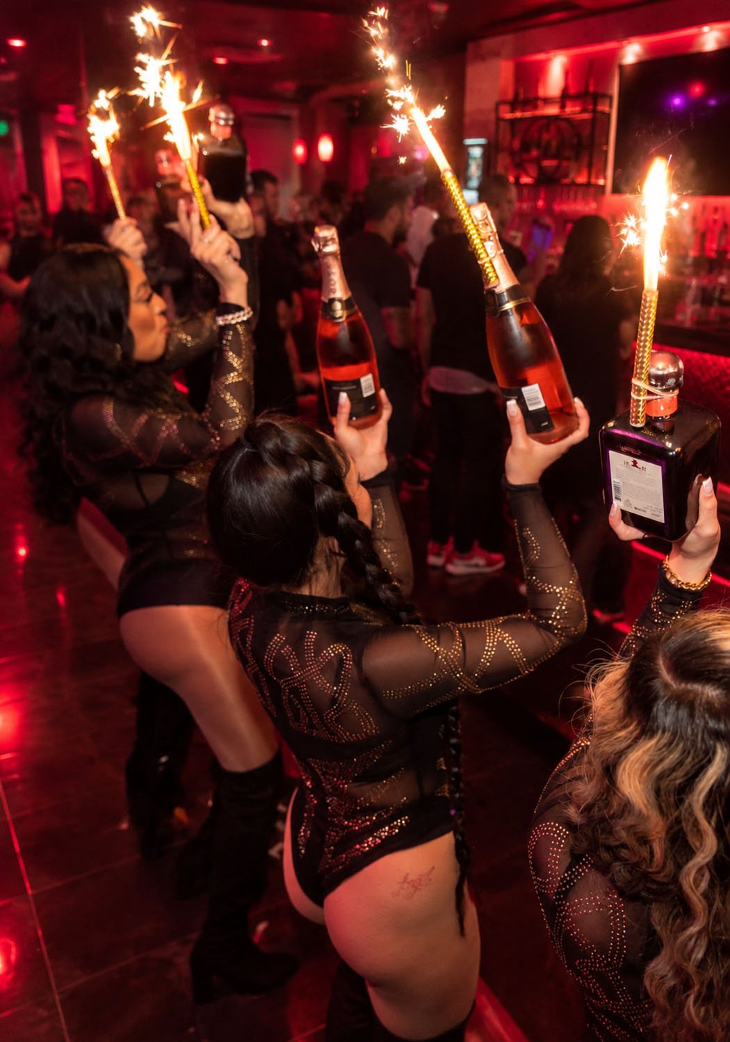 Bottle service at Rick's Seattle: champagne bottles with sparklers carried to the table