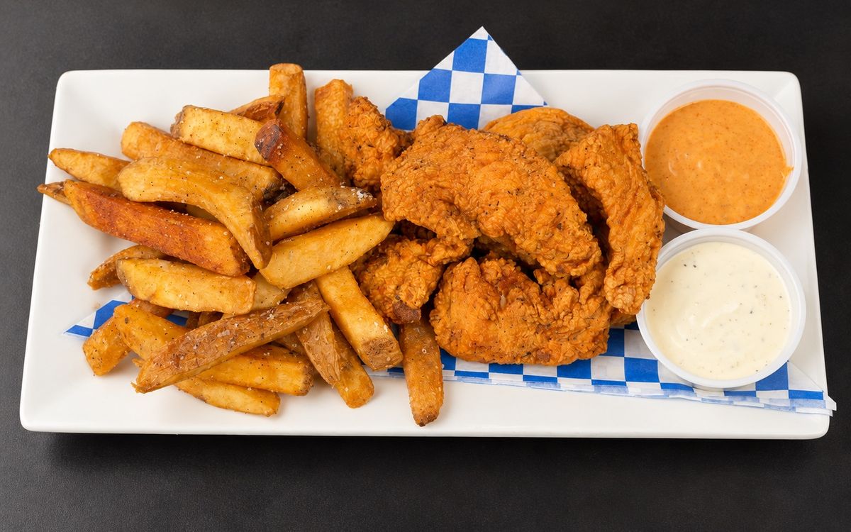 Jumbo fried chicken tenders with seasoned fries and two dipping sauces