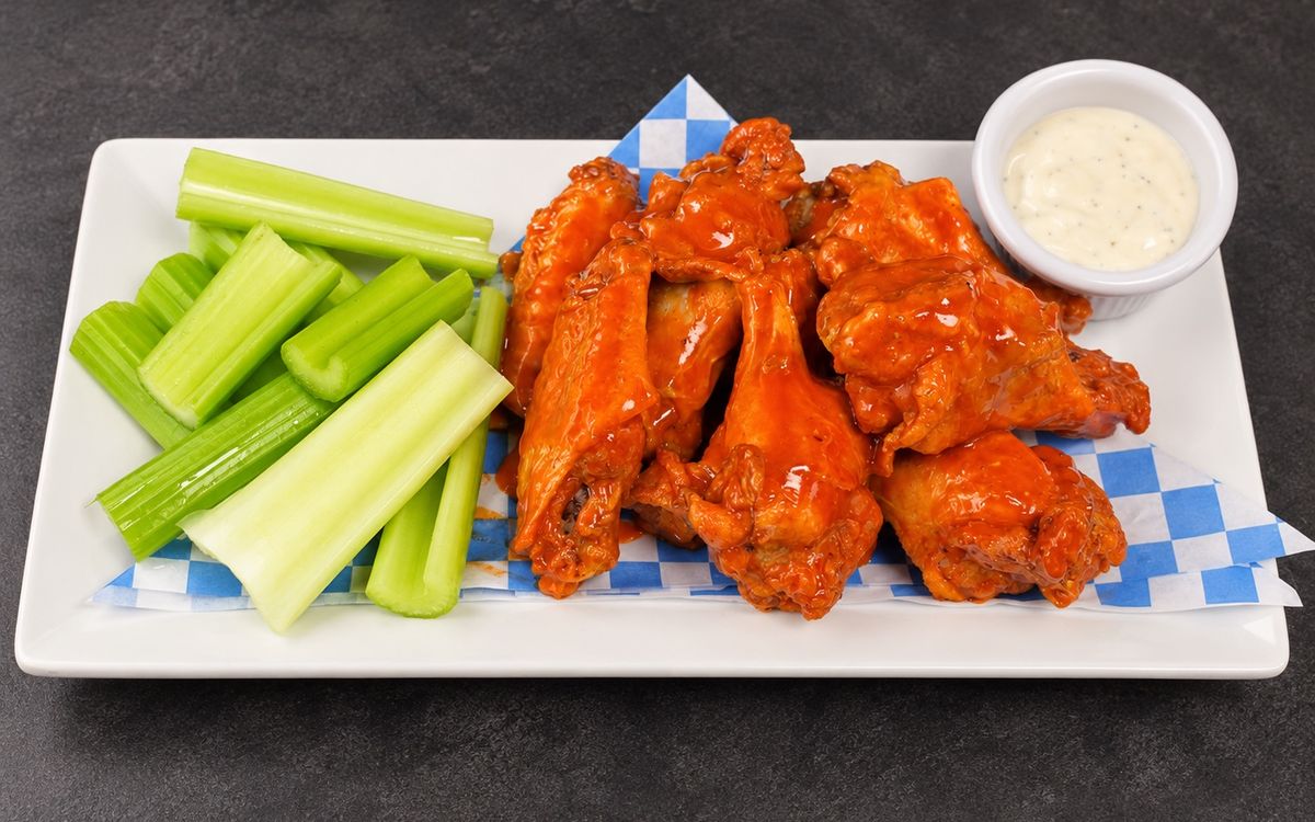 Buffalo bone-in wings with celery and ranch